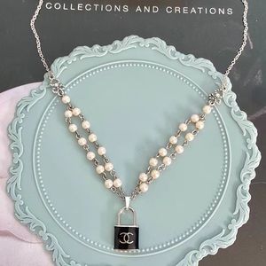 Chanel black lock pearl necklace
